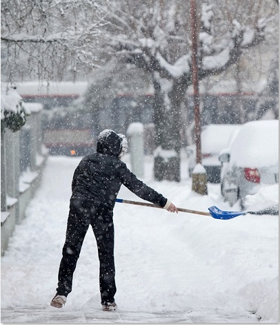 Man-shoveling-snow