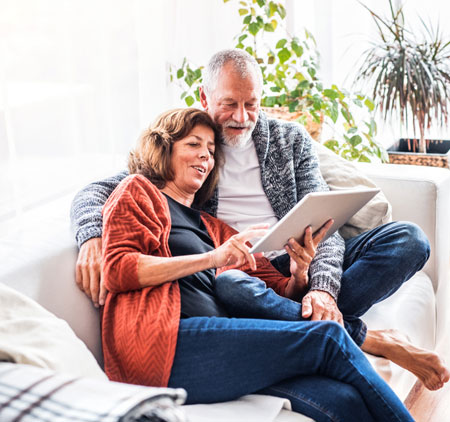 Old couple using a tablet
